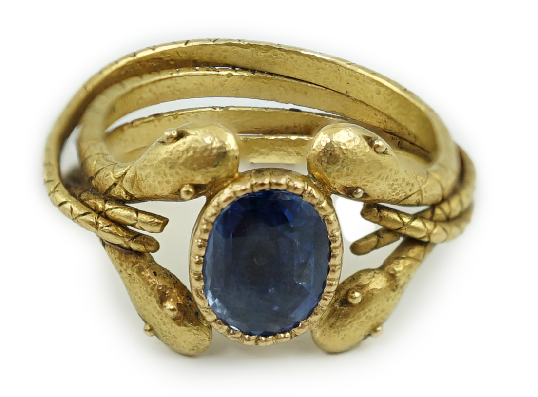 A late 19th century American Marcus & Co gold and single stone oval cut Sri Lankan sapphire set serpent ring